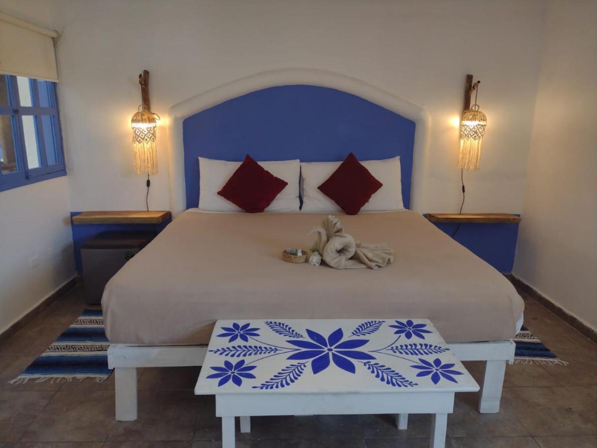 Mio Tulum Hotel Boutique Dış mekan fotoğraf A bedroom in a hotel in Santorini, Greece